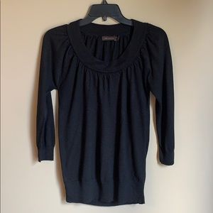 The limited black ruched neck blouse